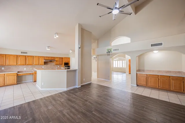 a kitchen with a sink a stove and cabinets