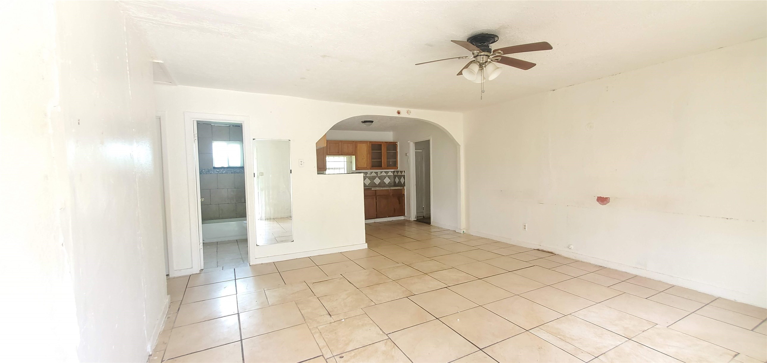 5238 Pershing Street Houston, TX 77033 - Photo 2 of 13 a view of a kitchen with a sink and a refrigerator