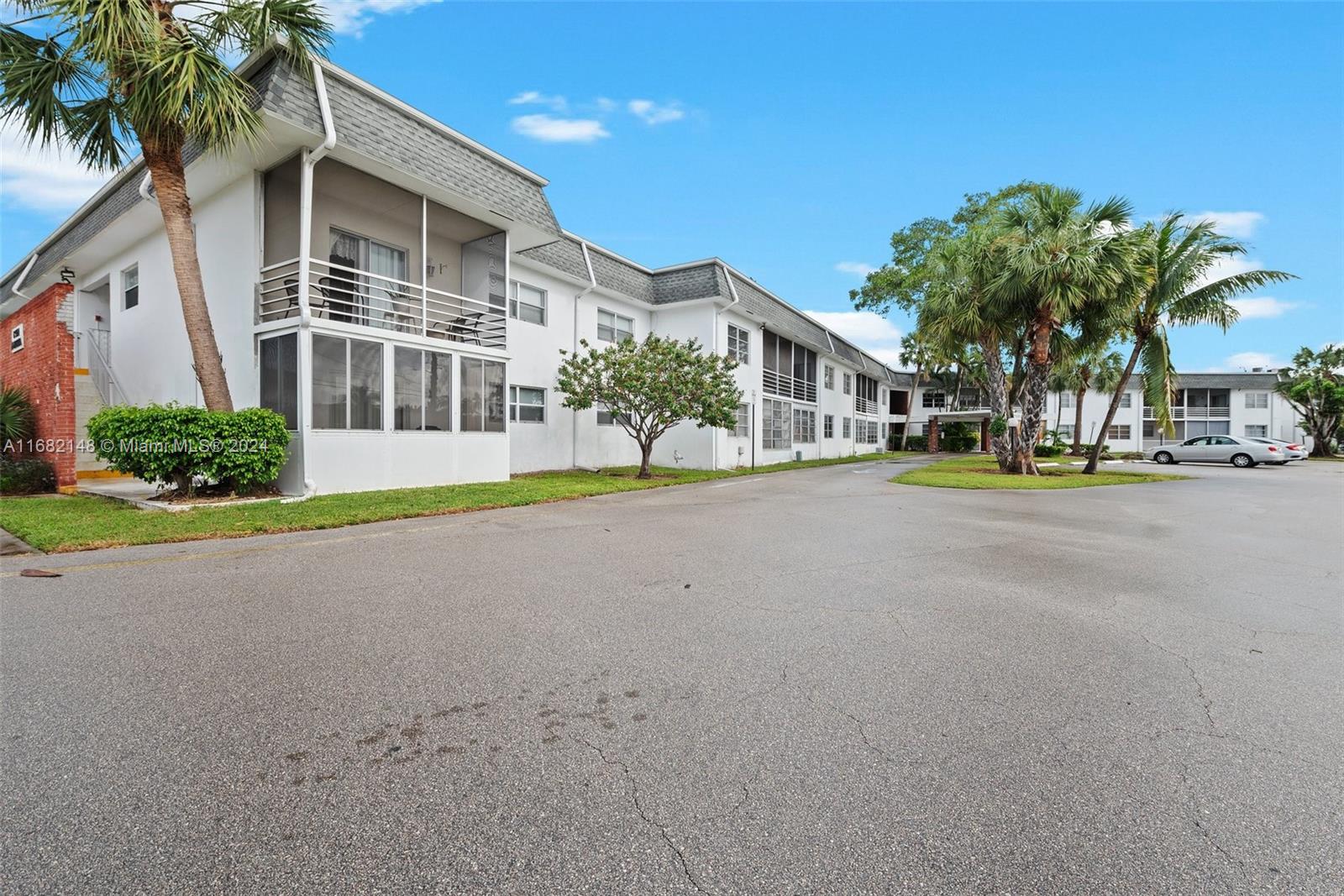 6501 Winfield Boulevard, Unit A31 Margate, FL 33063 - Photo 2 of 25 a front view of multiple house with garage and plants