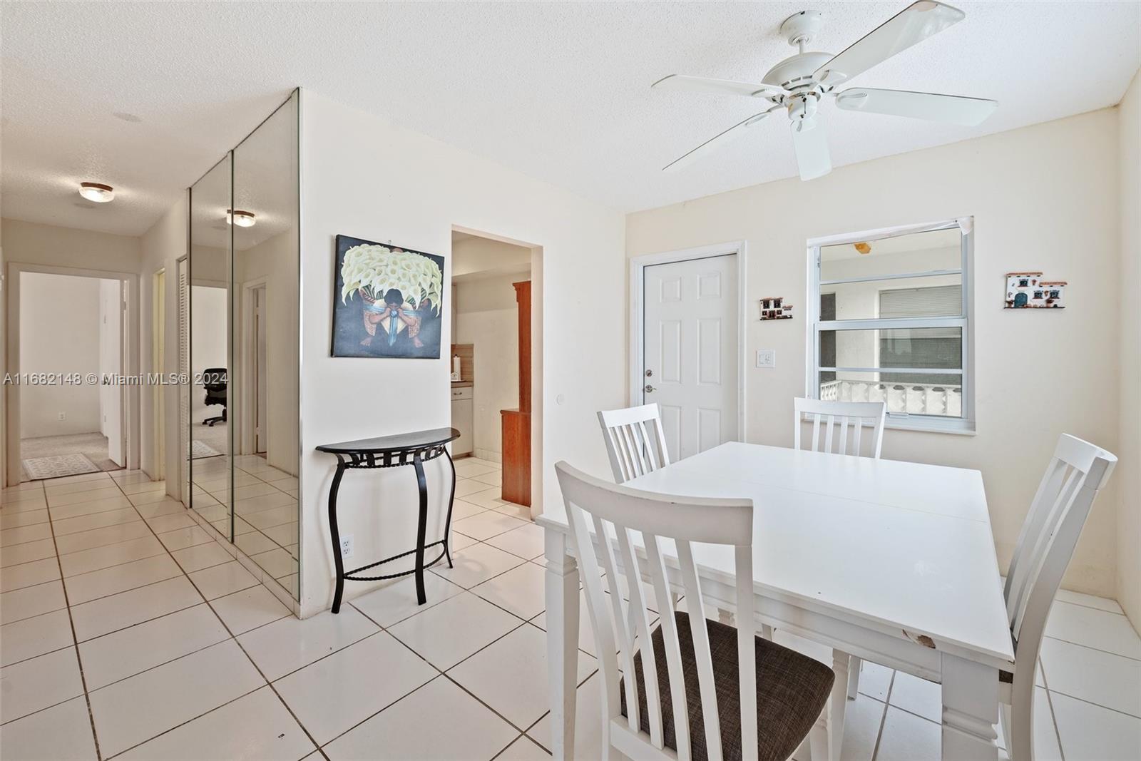 6501 Winfield Boulevard, Unit A31 Margate, FL 33063 - Photo 6 of 25 a view of a dining room with furniture and window