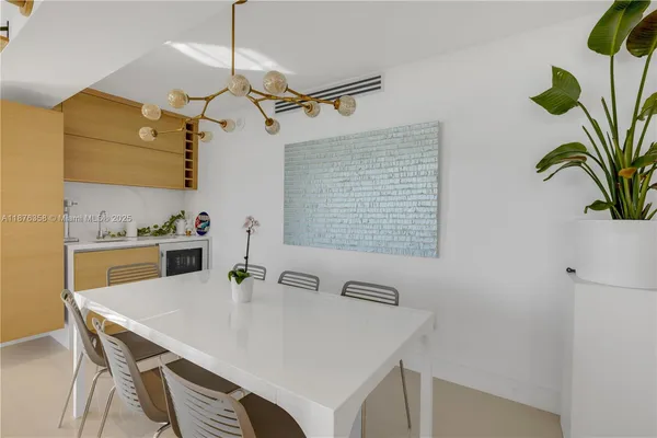 a view of a dining table and chairs in the kitchen