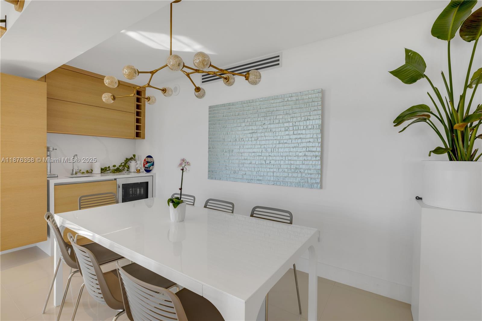 3739 Collins Avenue, Unit N501 Miami Beach, FL 33140 - Photo 8 of 19 a view of a dining table and chairs in the kitchen