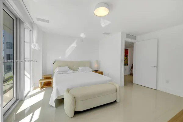 a bedroom with a bed and a cabinets