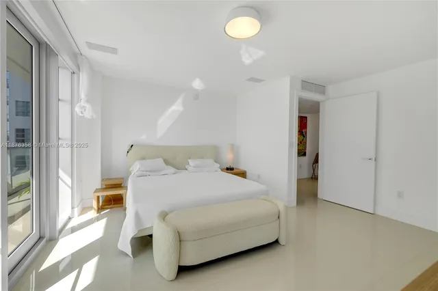 a bedroom with a bed and a cabinets