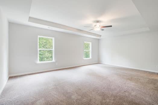 297 Whitetail Circle Canton, GA 30115 - Photo 16 of 35 an empty room with windows and ceiling fan