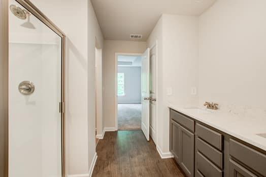 297 Whitetail Circle Canton, GA 30115 - Photo 19 of 35 a view of a hallway with wooden floor