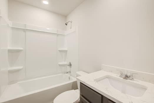 297 Whitetail Circle Canton, GA 30115 - Photo 21 of 35 a bathroom with a granite countertop sink toilet and bathtub
