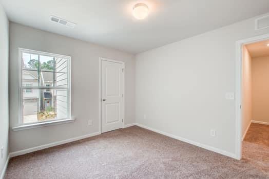 297 Whitetail Circle Canton, GA 30115 - Photo 26 of 35 an empty room with a window