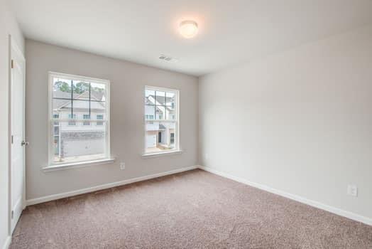 297 Whitetail Circle Canton, GA 30115 - Photo 27 of 35 an empty room with a window