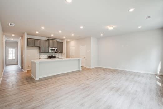 297 Whitetail Circle Canton, GA 30115 - Photo 10 of 35 a view of kitchen with kitchen island sink refrigerator and white cabinets
