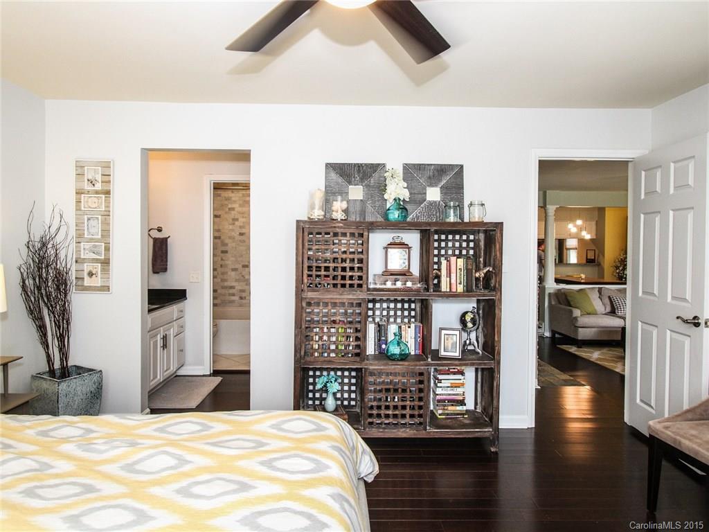 318 Queens Road, Unit 5 Charlotte, NC 28204 - Photo 12 of 24 a bedroom with a bed and wooden floor