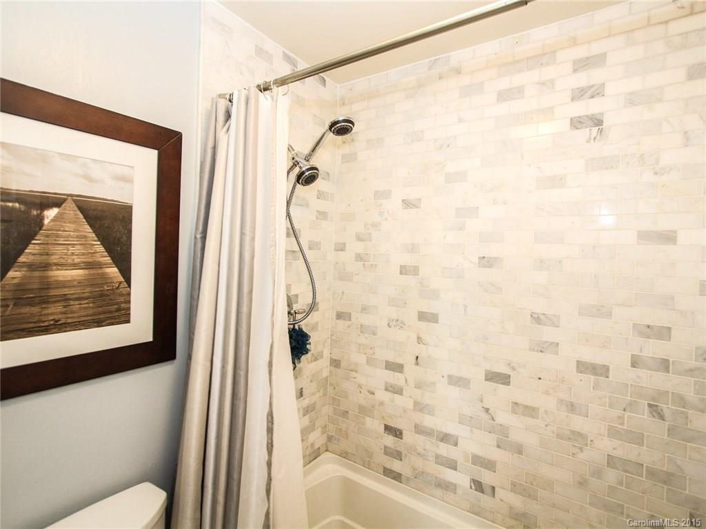 318 Queens Road, Unit 5 Charlotte, NC 28204 - Photo 14 of 24 a bathroom with a shower