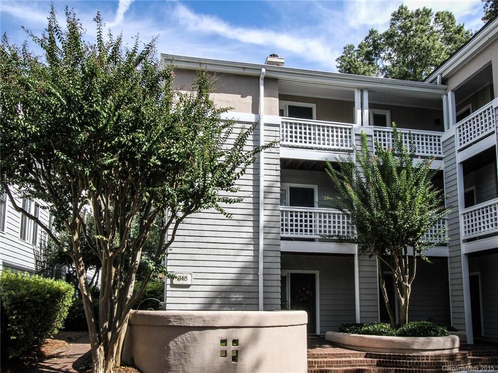 318 Queens Road, Unit 5 Charlotte, NC 28204 - Photo 23 of 24 a front view of a house with a yard