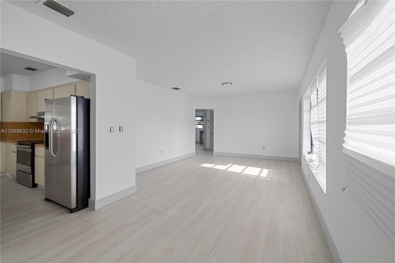 Westhaven Park Hialeah, FL 33012 - Photo 12 of 22 a view of a kitchen with furniture and a window