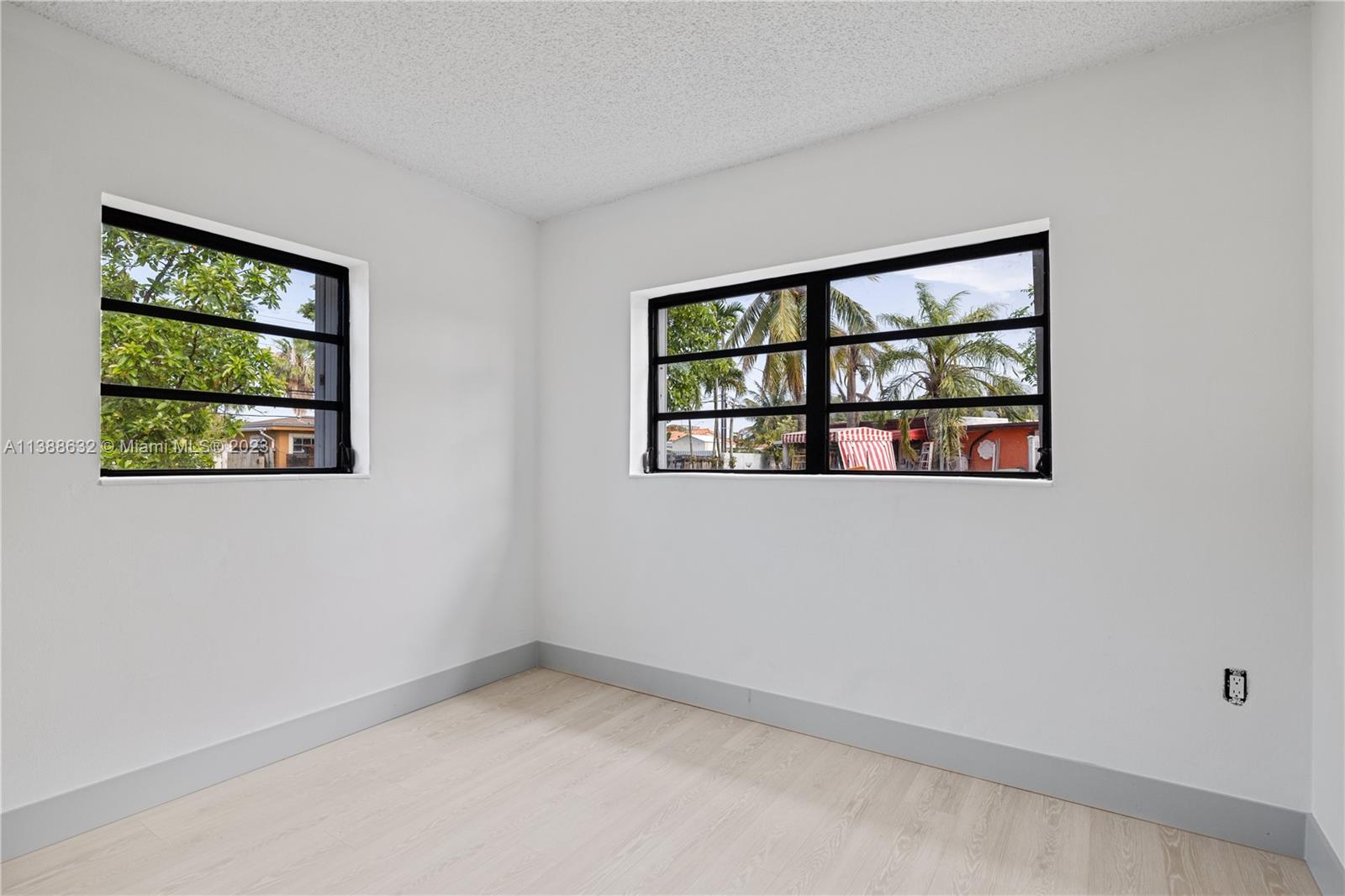 Westhaven Park Hialeah, FL 33012 - Photo 14 of 22 a view of empty room with windows