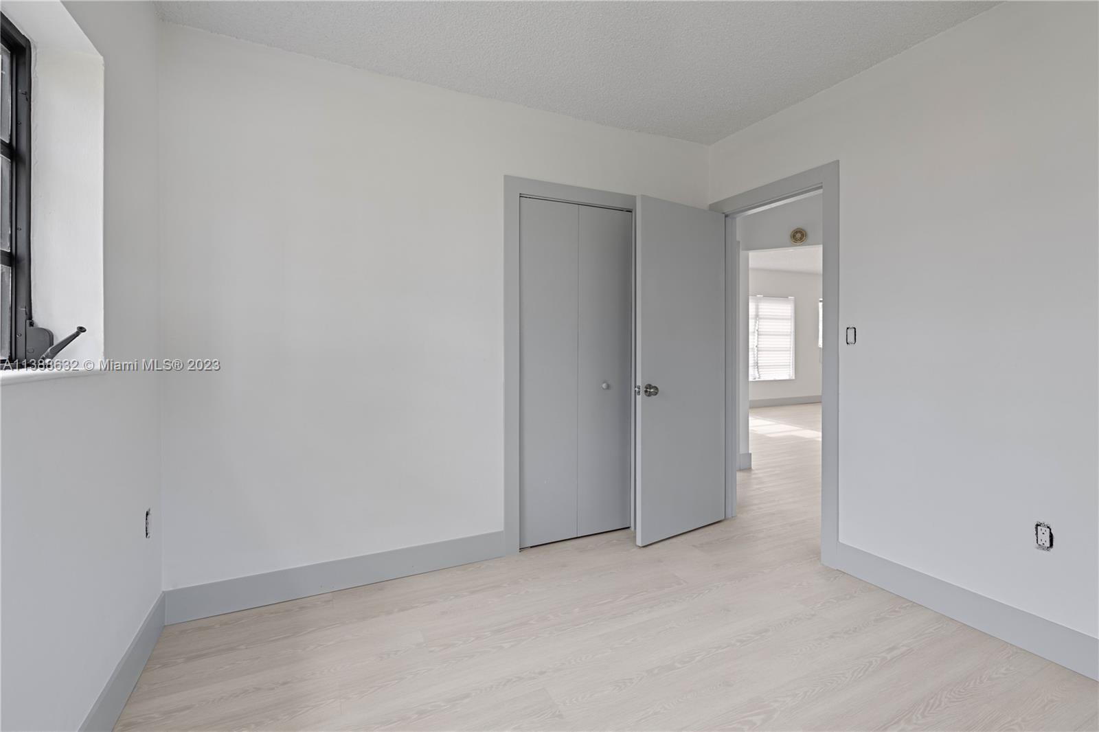 Westhaven Park Hialeah, FL 33012 - Photo 15 of 22 an empty room with windows
