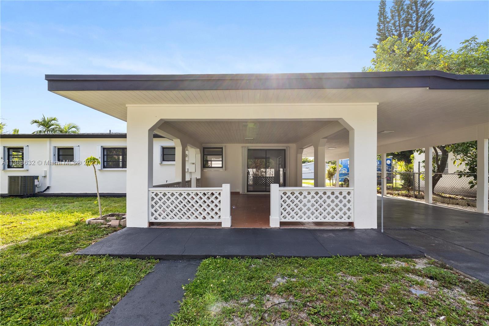 Westhaven Park Hialeah, FL 33012 - Photo 7 of 22 front view of a house with a yard