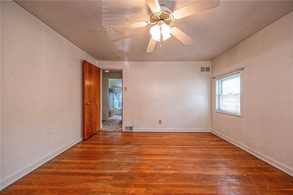 1704 Duffield Street Pittsburgh, PA 15206 - Photo 13 of 32 wooden floor in an empty room with a window