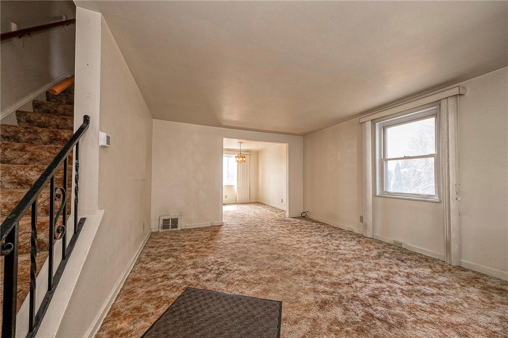 1704 Duffield Street Pittsburgh, PA 15206 - Photo 3 of 32 a view of an empty room with window and stairs