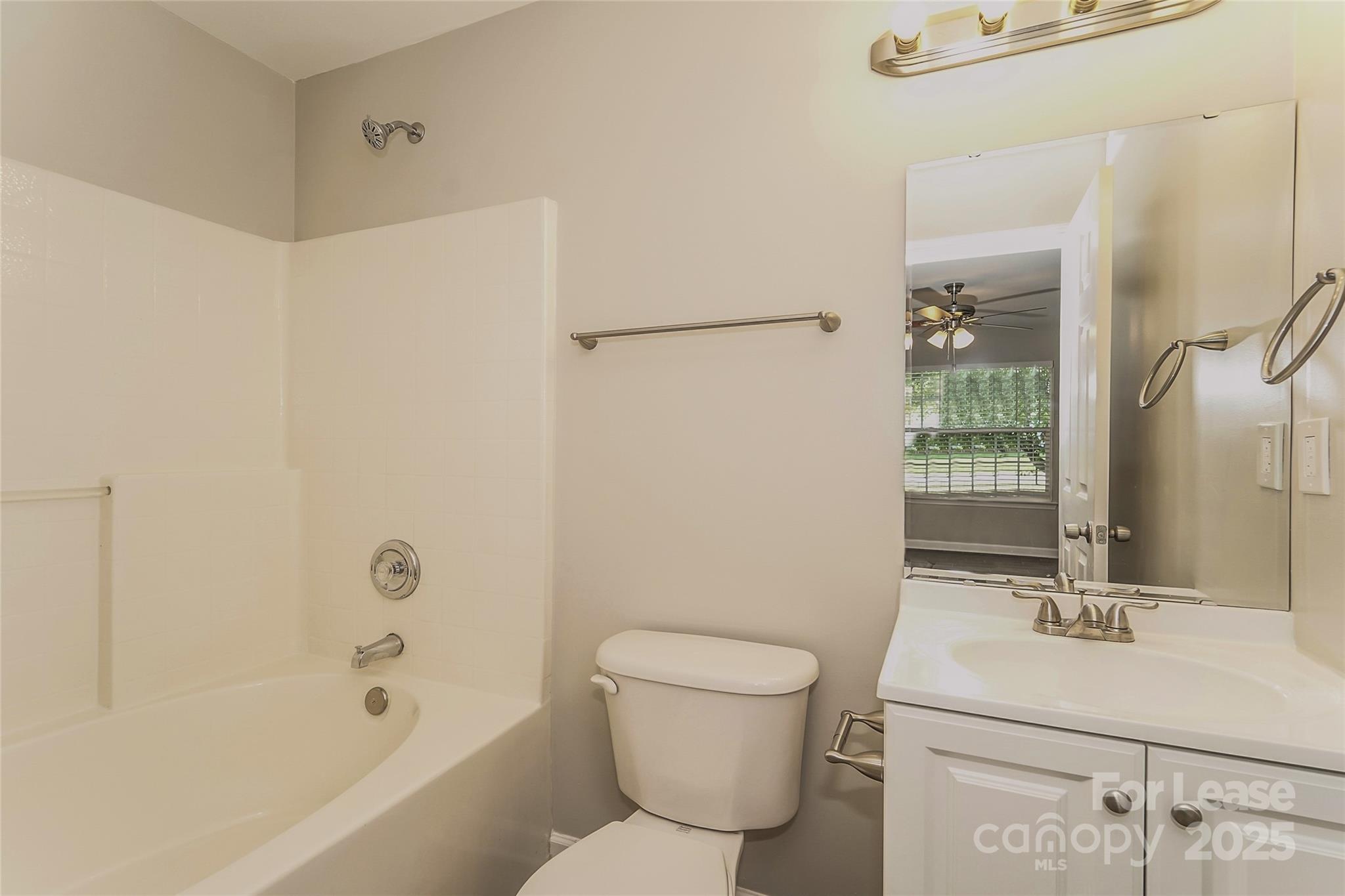 3931 Bitterroot Court Charlotte, NC 28269 - Photo 14 of 16 a bathroom with a sink toilet and shower