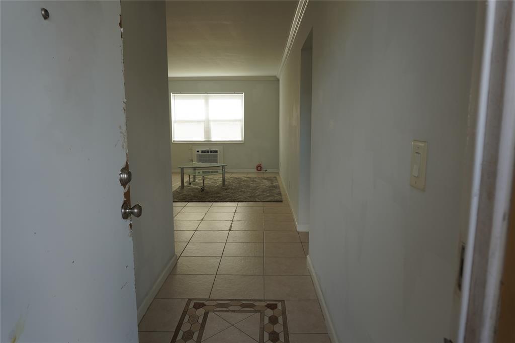 1050 East Sample Road, Unit 104 Pompano Beach, FL 33064 - Photo 2 of 14 a bathroom with a shower