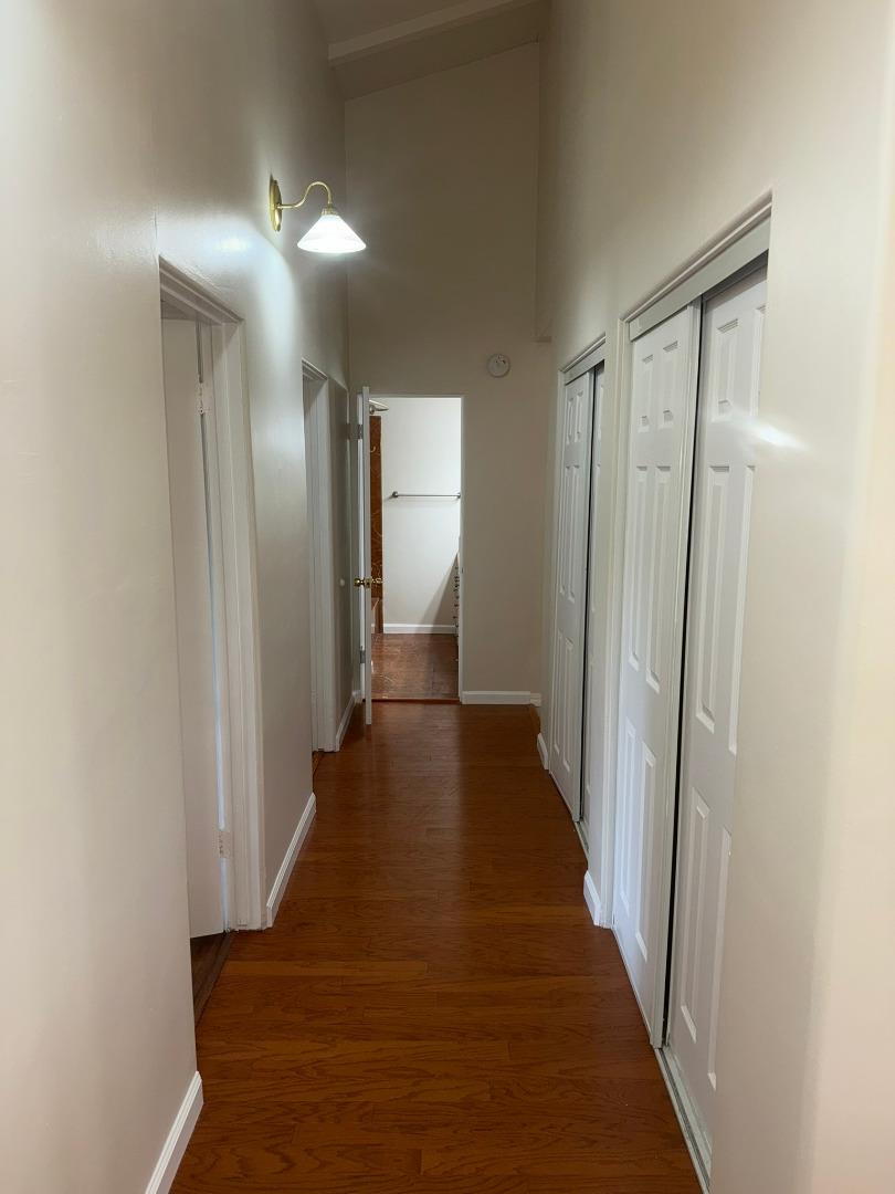 11585 McCarthy Road Carmel Valley, CA 93924 - Photo 30 of 52 a view of a hallway with wooden floor
