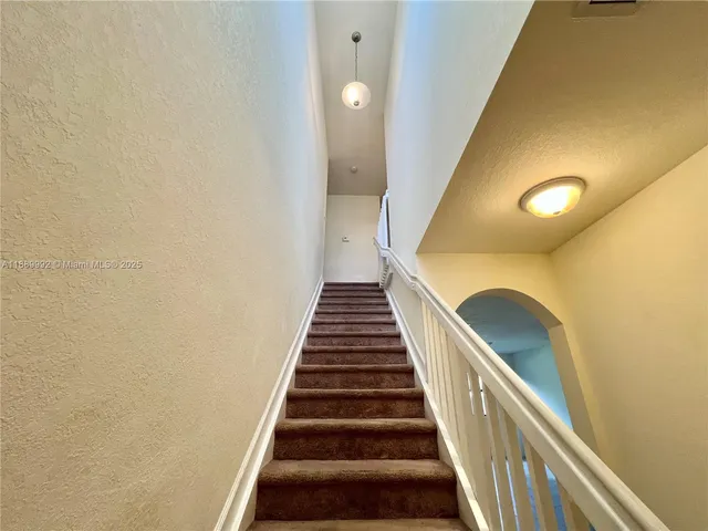 a view of empty room with windows