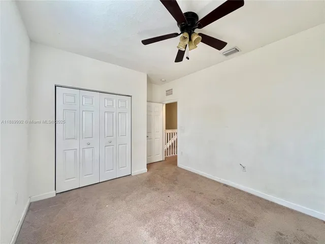 an empty room with a empty space and a window