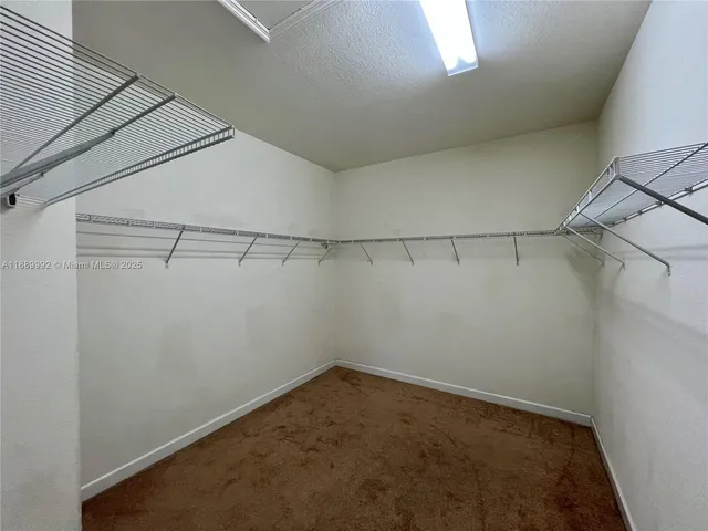 a bathroom with a sink toilet vanity and shower