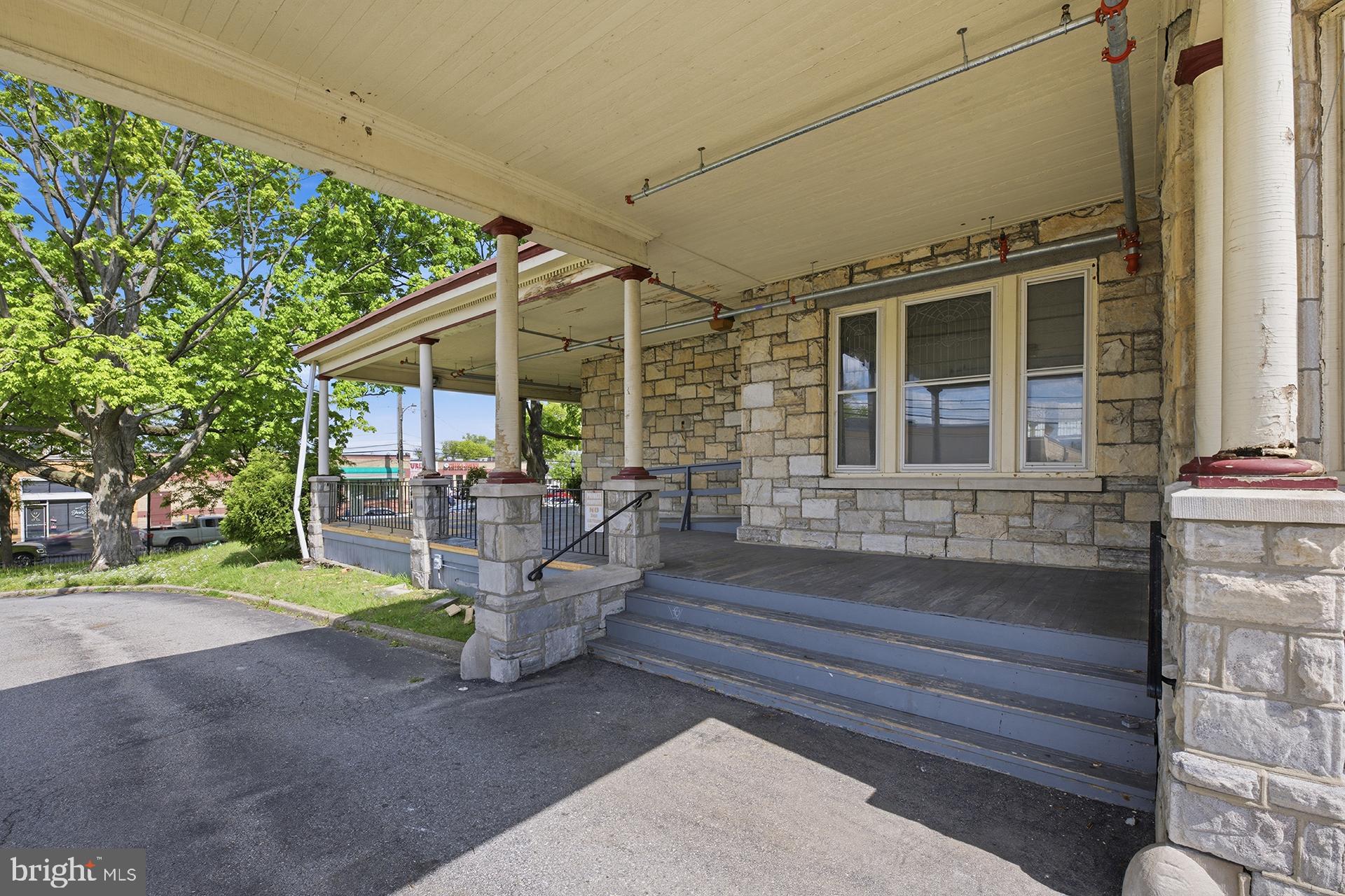 6012 Ridge Avenue, Unit 1 Philadelphia, PA 19128 - Photo 16 of 17 a front view of a house with garden
