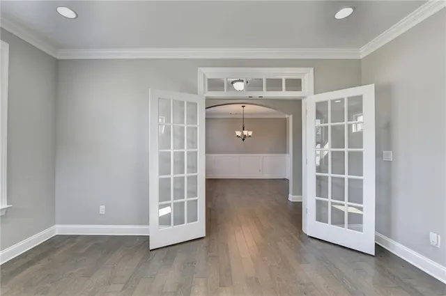 a view of an empty room with a fireplace and a window