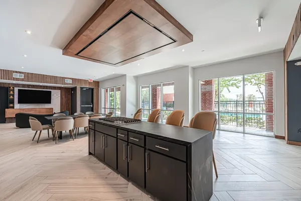 a bedroom with furniture and a mirror