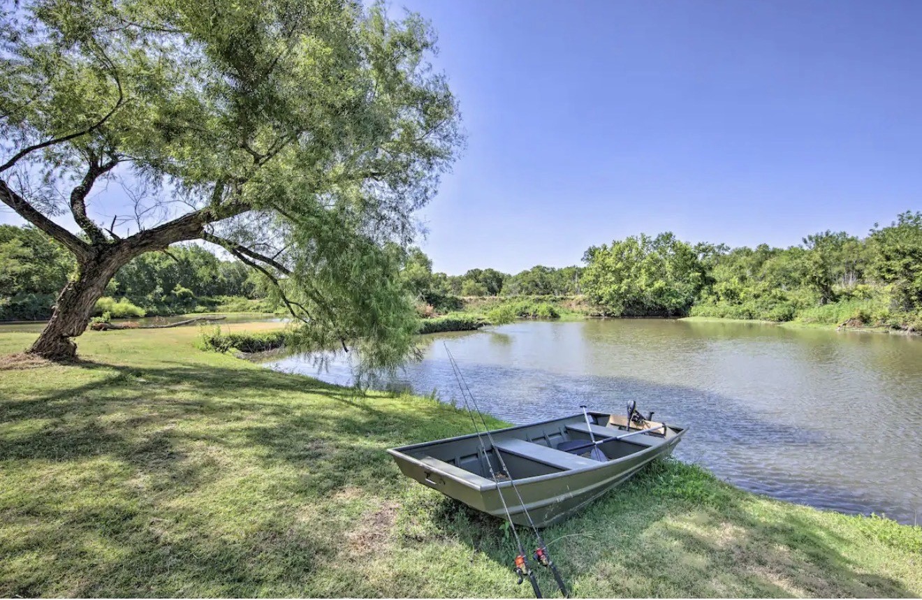 a view of a lake with a house in the background