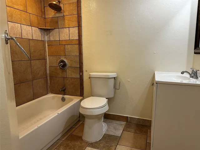 a bathroom with a sink and toilet