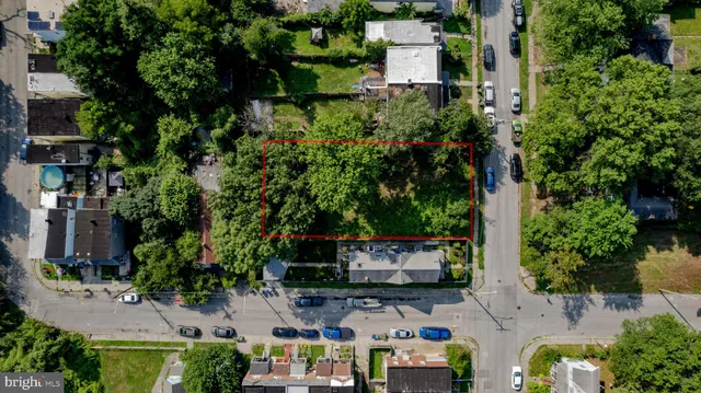 an aerial view of a house with outdoor space