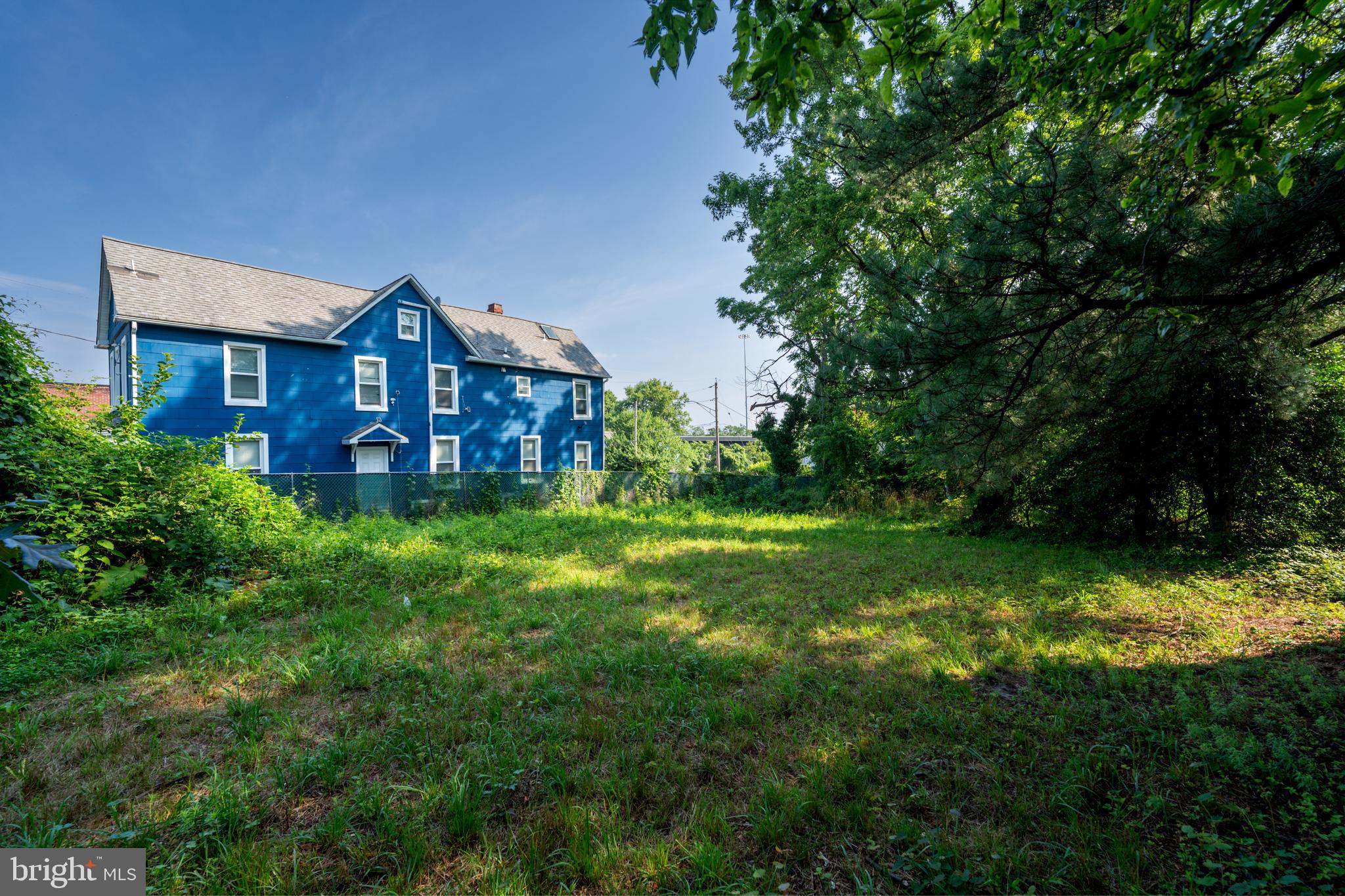 1707 Spence Street Baltimore, MD 21230 - Photo 7 of 9 a front view of a house with a yard