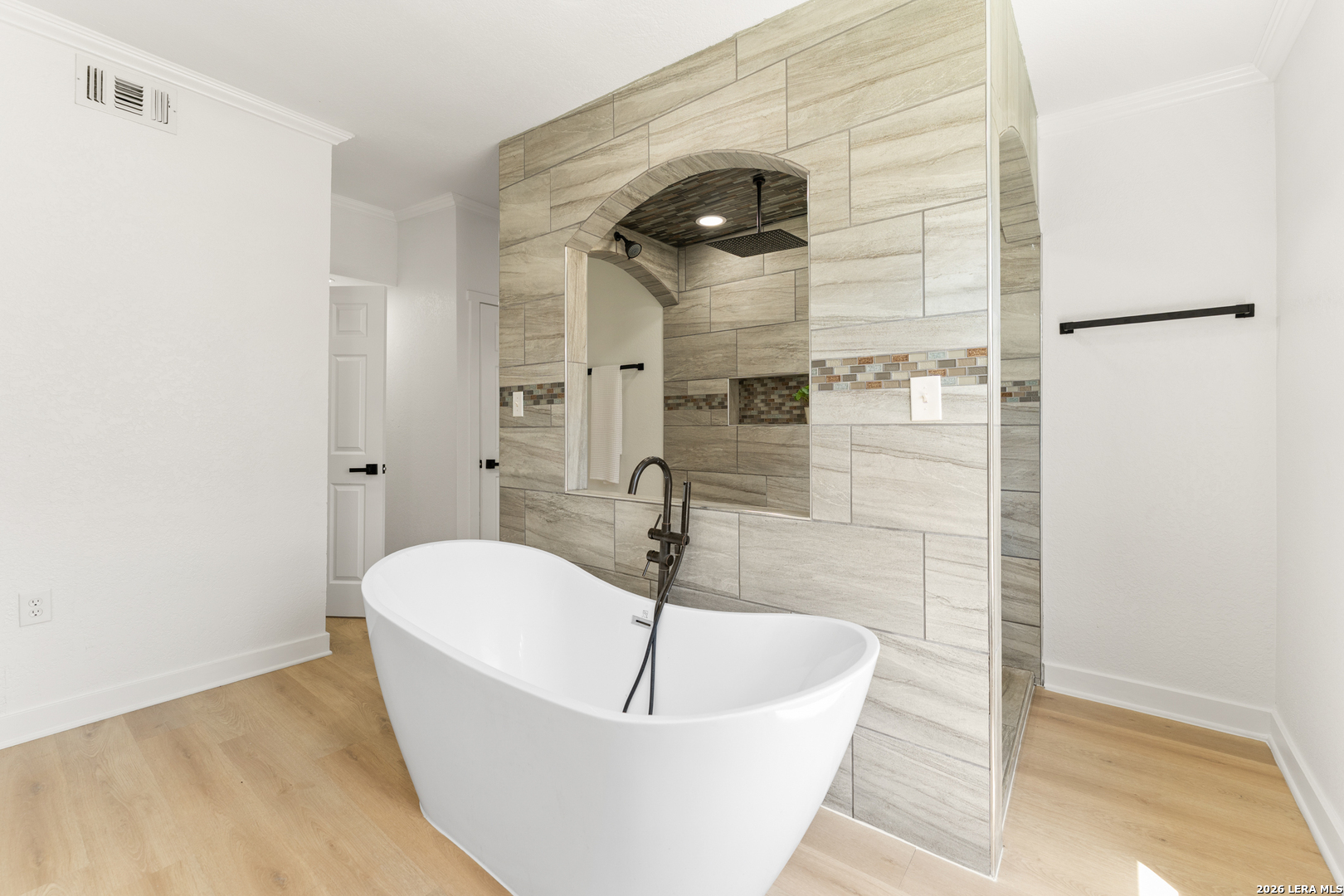 670 Quail Run Lytle, TX 78052 - Photo 15 of 31 a bathroom with a sink and shower