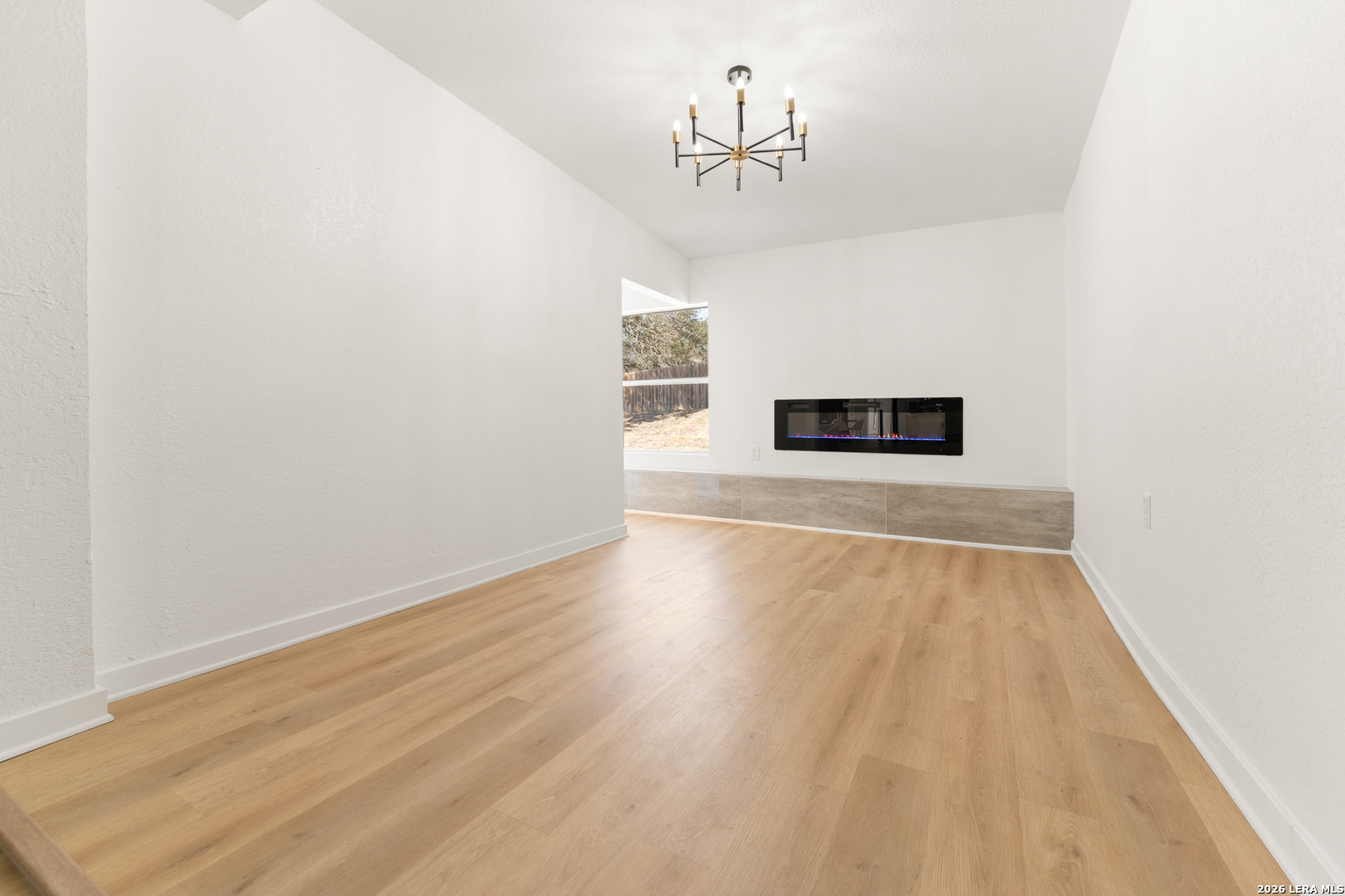 670 Quail Run Lytle, TX 78052 - Photo 24 of 31 a view of a room with wooden floor