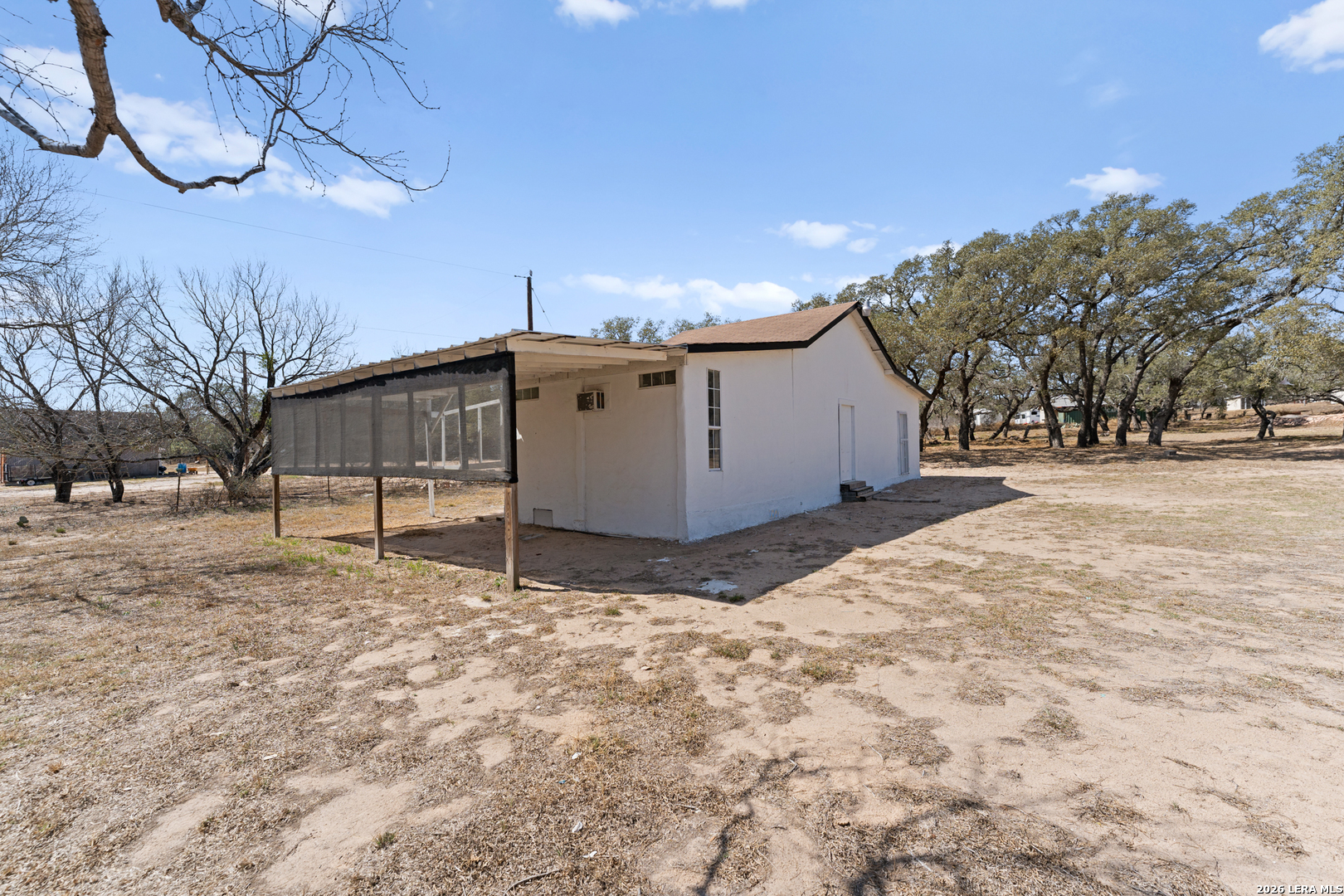 670 Quail Run Lytle, TX 78052 - Photo 26 of 31 a view of a backyard of a house