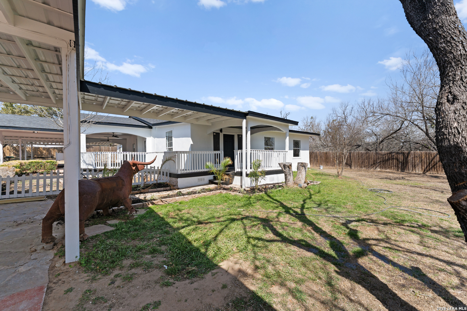 670 Quail Run Lytle, TX 78052 - Photo 29 of 31 a view of a house with backyard porch and sitting area