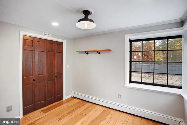 a kitchen with kitchen island granite countertop a stove and a refrigerator