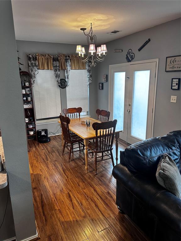 103 Denali Court Terrell, TX 75160 - Photo 12 of 39 a living room with furniture and a chandelier