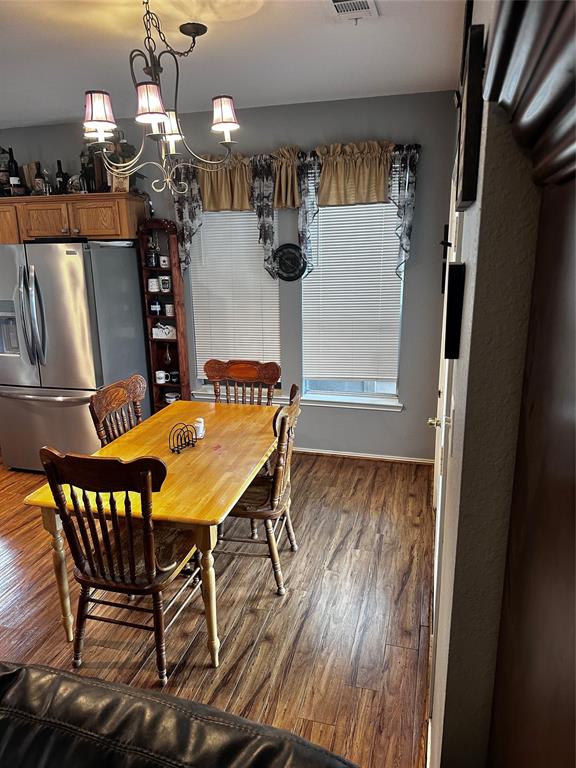 103 Denali Court Terrell, TX 75160 - Photo 13 of 39 a view of a dining room with furniture and wooden floor