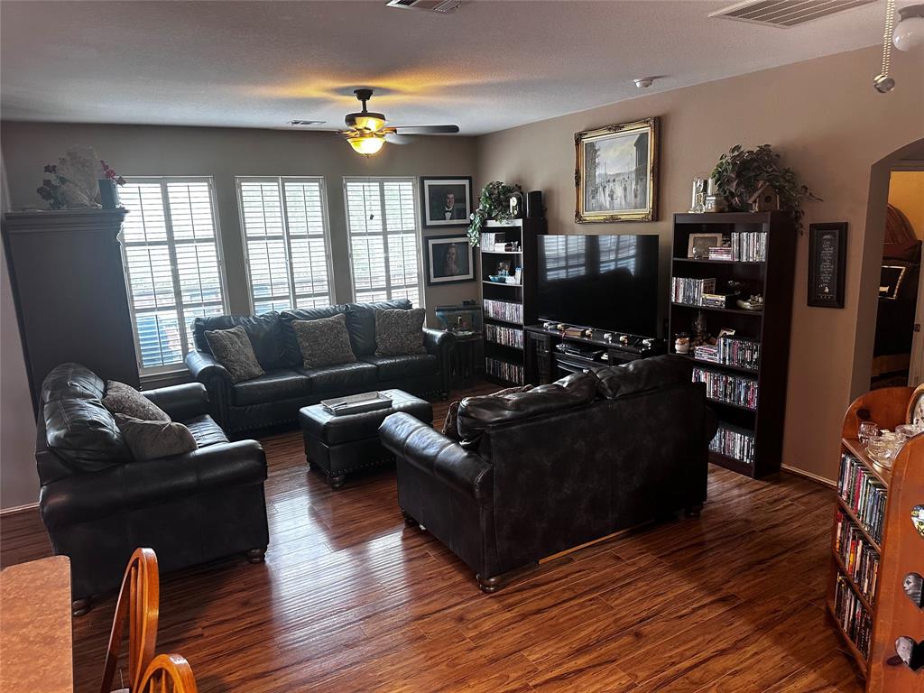 103 Denali Court Terrell, TX 75160 - Photo 14 of 39 a living room with furniture window and wooden floor