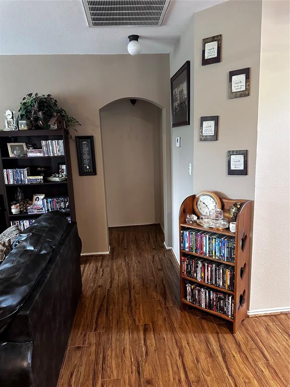 103 Denali Court Terrell, TX 75160 - Photo 16 of 39 a bedroom with furniture and book shelf