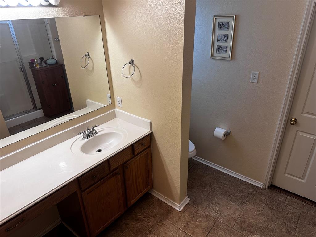 103 Denali Court Terrell, TX 75160 - Photo 20 of 39 a bathroom with a double vanity sink and mirror
