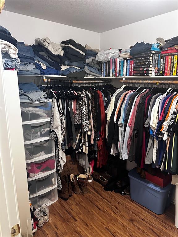 103 Denali Court Terrell, TX 75160 - Photo 23 of 39 a view of walk in closet with clothes and shoes