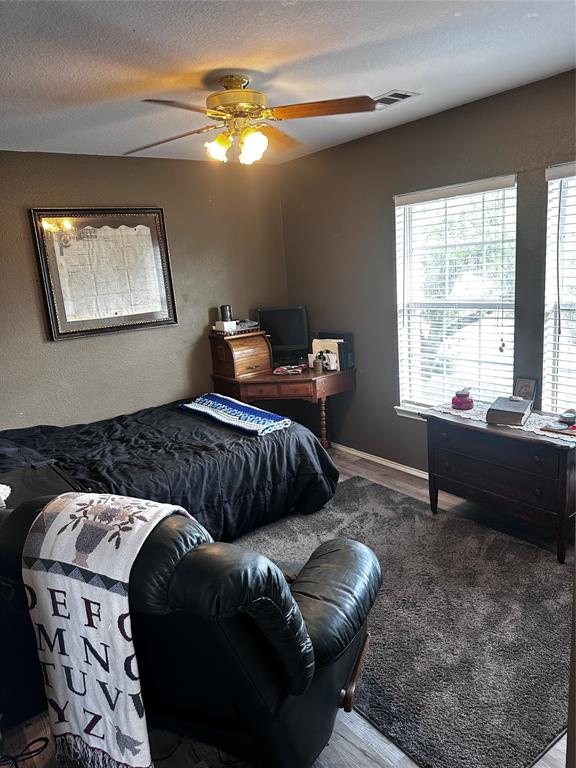 103 Denali Court Terrell, TX 75160 - Photo 25 of 39 a bedroom with two beds and a window