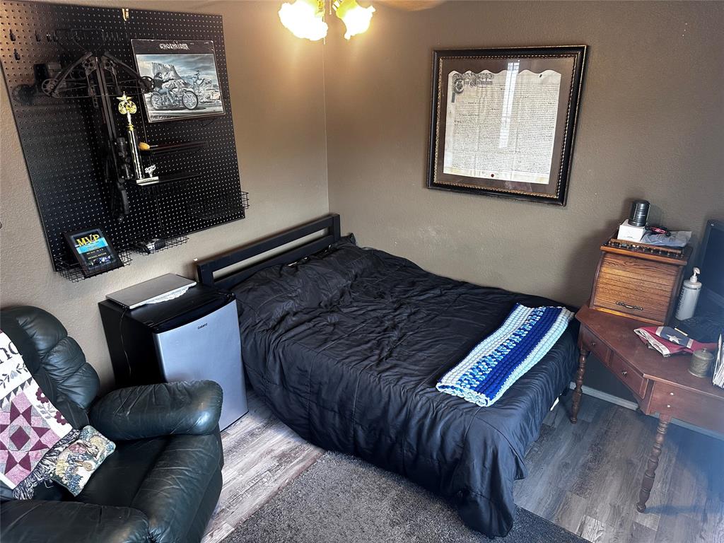 103 Denali Court Terrell, TX 75160 - Photo 26 of 39 a bed sitting in a bedroom next to a window