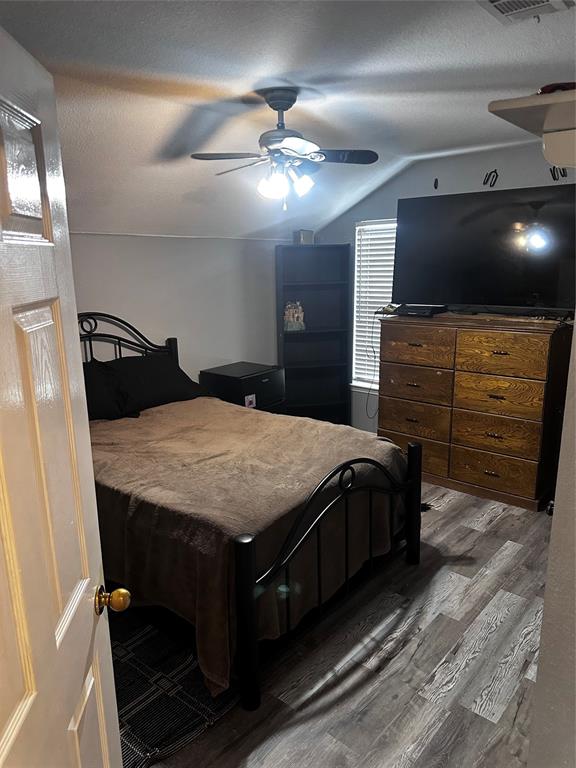 103 Denali Court Terrell, TX 75160 - Photo 31 of 39 a bedroom with a bed and a flat screen tv